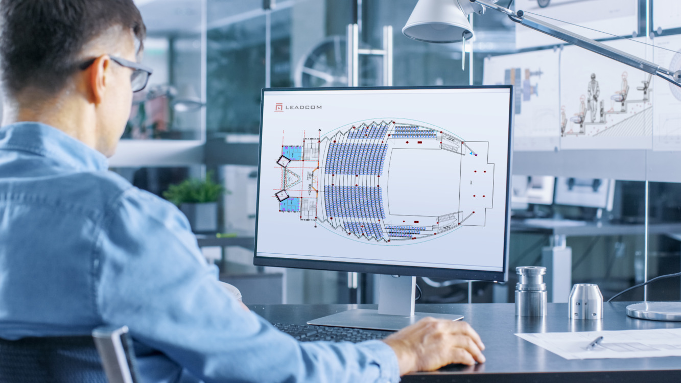 Automotive Engineer Works on the Personal Computer, He Perfects New Car Model Prototype Sketch. He Works in the Bright and Modern Office.